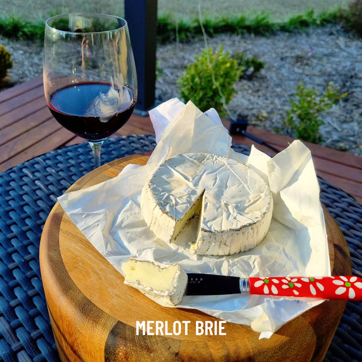 Coolamon Cheese Co. Merlot Brie Double Cream Brie Cheese Handmade Artisan with Glass of Merlot Red Wine